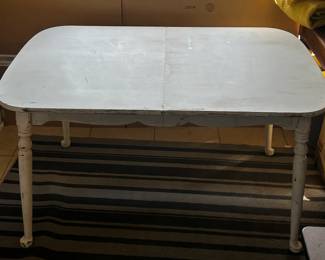 Vintage American Classic Farmhouse Dining table with turned dining table legs. The table's base is painted white and naturally distressed to show some character in certain curves and edges.
Dimensions: 29" Height x 36" Wide x 54" Deep
The top is a 1" thick plank top.
Disclosures: This table is in excellent condition with normal signs of wear for a piece of this age. (Please see the pictures for details.)