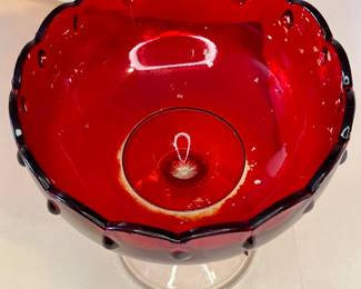 Vintage 1950s Pedestal Ruby Red Teardrop Glass Bowl
The 1950s Ruby Red Indiana Glass ~ Teardrop Compote Dessert Pedestal Bowl. This bowl has beautiful details, a scalloped rim, and a teardrop design. There are no chips or cracks. The ruby red color wasn't baked into the glass; they found it cheaper to apply the paint, so the inside is a delicate surface. With small imperfections, this is a beautiful bowl to display as a centerpiece in your home.
This dish was purchased new in the 1950s and remained with the original owner. She is downsizing and is now available for purchase.
Disclosures: This case is in good condition with signs of wear, including fading of the red inside the bowl. There are NO chips or scratches in the glass. See pictures for details.
Dimensions: 7.5" Height x 7.5" Top Circumference x 4.5" Bottom Circumference