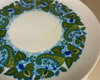 Vintage 1960s Set of 18 Allied Chemical 59 Melmac Paisley and Leaf Plates
Disclosures: This set is in excellent condition with normal signs of wear for this age set. (Please see the pictures for details.)
Dimensions: 9.5" Circumference x .75" Height - curve around edges ensure the contents remain in place.
Melamine Design History: Melamine resin is often used in kitchen utensils and plates (such as Melmac.)
During the late 1950s and 1960s, melamine and tableware became fashionable. Aided by the stylish modern designs of A.H. Woodfull and the Product Design Unit of British Industrial Plastics, it was thought to threaten the dominant position of ceramics in the market. Known for their lightweight design and resistance to breaking, they became an excellent daily-use alternative.