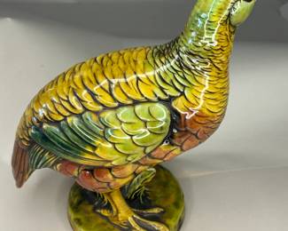 An imperious grouse in turquoise, mustard, and paprika tones. Enesco paper label and stamp on the underside of the base.
This piece was purchased new in the 1960s and remained with the original owner. She is downsizing and is now available for purchase.
Dimensions: 8" Width x 4 5/8" Depth x 10 5/8" Height
Disclosures: This piece is in great condition with normal wear, including one chip in the beak area. (Please see the pictures for details.