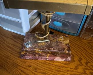 Brass and Marble Bankers Light: The item may have some signs of cosmetic wear but is in proper working order. Pattern Marbled
Power Source Wall Plug-In
Color Maroon, Gold
Material Brass, Marble
Item Length
Approximately 10”
Type Desk Lamps
Sensor Type Light Bulb
Era Late 20th Century (1970-1999)