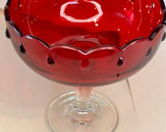 Vintage 1950s Pedestal Ruby Red Teardrop Glass Bowl
The 1950s Ruby Red Indiana Glass ~ Teardrop Compote Dessert Pedestal Bowl. This bowl has beautiful details, a scalloped rim, and a teardrop design. There are no chips or cracks. The ruby red color wasn't baked into the glass; they found it cheaper to apply the paint, so the inside is a delicate surface. With small imperfections, this is a beautiful bowl to display as a centerpiece in your home.
This dish was purchased new in the 1950s and remained with the original owner. She is downsizing and is now available for purchase.
Disclosures: This case is in good condition with signs of wear, including fading of the red inside the bowl. There are NO chips or scratches in the glass. See pictures for details.
Dimensions: 7.5" Height x 7.5" Top Circumference x 4.5" Bottom Circumference