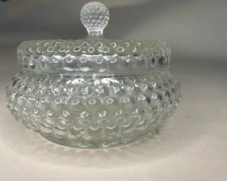 Vintage Anchor Hocking Hobnail Vanity Powder Glass Bowl with Lid
This vanity powder holder was purchased new in the 1960s and remained with the original owner. She is downsizing and is now available for purchase.
Disclosures: This set is in excellent condition with normal signs of wear for a piece of this age. No chips or cracks are present. (Please see the pictures for details.)
Dimensions with Lid: 3.5" Height x 4.5" Top Circumference of the Lid
Dimensions of Dish without the Lid: Height Approximately 2.5" x 3.5" Top 3.25" Circumference x Bottom Circumference
Weight: 10.8 Ounces