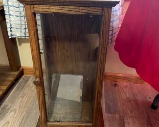 Small curio with glass shelves