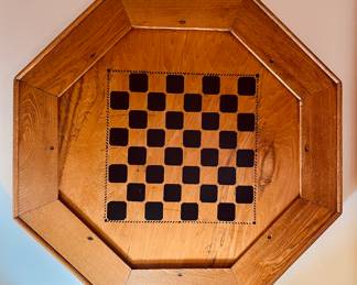 Antique wood hexagon game tabletop with wood checkers.