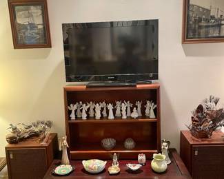 TV, black & white photographs framed from the 1950's, porcelain, angels, Brumm art sculptures, carved coffee table, Fisher speakers