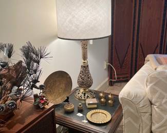 Pair of brass Filigree lamps, pair of wood inlay end tables, brass bells, brass plates from extensive world travels.