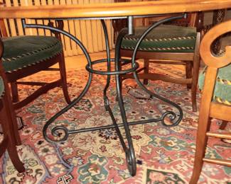 Very cool round wooden table (47" in diameter) with iron legs and 4 chairs, like new condition. Was *$685.00* now $500.00.