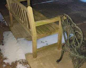 Wooden patio/garden bench.
Cast iron patio chair.
