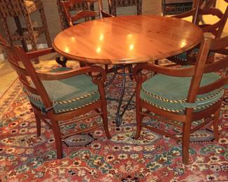 Round table with iron legs and 4 chairs' like new condition $600.00.