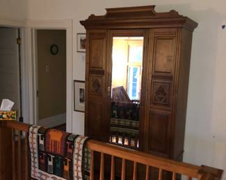 Antique mirrored armoire