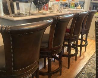 Four handsome leather barstools