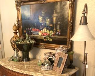 Framed still life art; decorative accessories; floor lamp