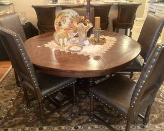 Good looking round dining table with 6 chairs