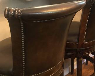 Nailhead trim on each barstool