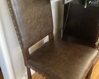 One of six dining chairs  .  .  . nailhead trim