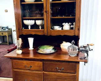 Antique Kitchen Hutch.  Antique meat grinder.  You'll finally know how the sausage is made.  Tons of milk glass and Hull pottery in this sale. 