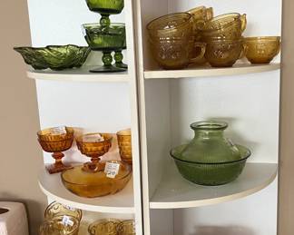 Thumbprint, amber glass SOLD. NEAT WHITE SHELVES (2)