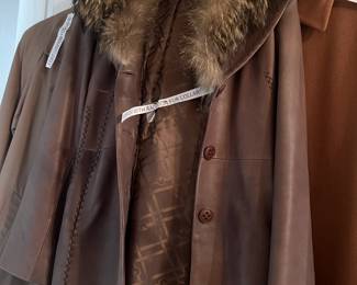 Leather coat with raccoon collar, other coats.