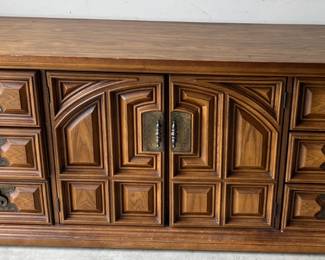 Large dresser with tons of drawers.  Behind the doors are more drawers!