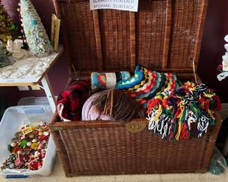 Handmade afghans (back in style with the "new" grandma decor), blankets.  Look at that rattan chest.  Tub of Christmas ornaments.