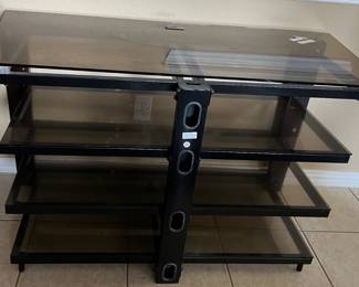 A rather large glass TV stand and table.  Very modern look.