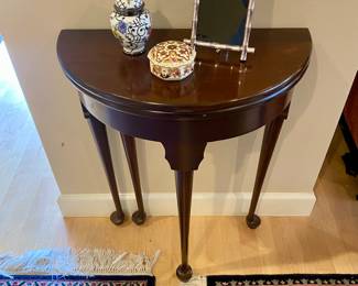 Accent table (opens up to be round ) with decorative accessories