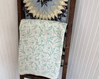 Vintage quilts and ladder