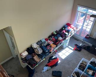 Tons and tons of clothes.  All sizes - many designer, many brand new with tags.