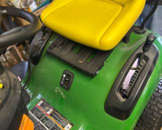 John Deere riding lawnmower, with shade canopy and tow behind cart