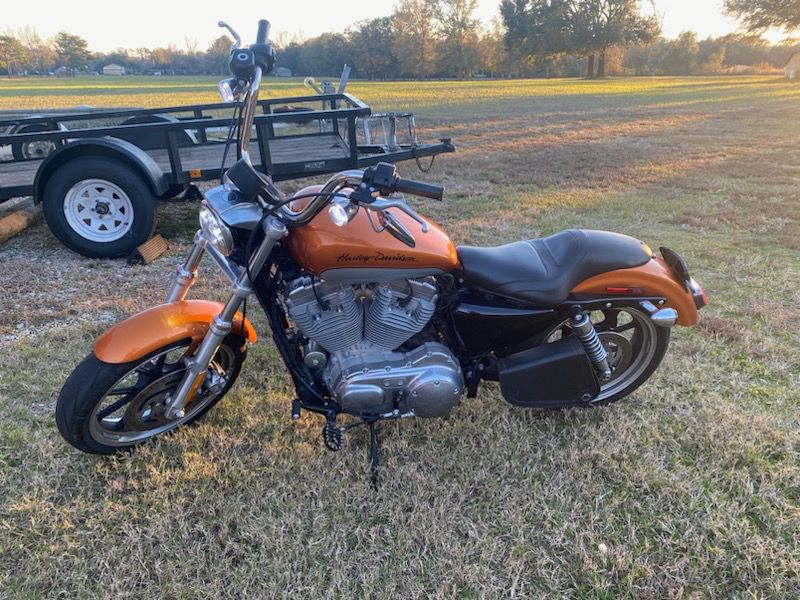 Beautiful 2014 Harley Davidson Sportster. We also have two HD helmets.