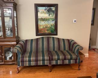 Striped loveseat and matching couch.