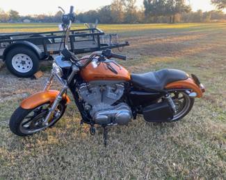 Beautiful 2014 Harley Davidson Sportster. We also have two HD helmets.