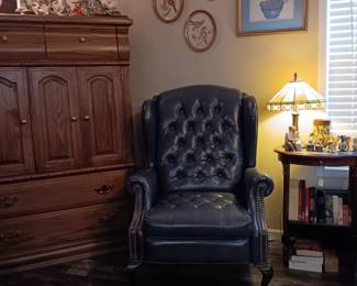 Wingback chair, crosses, bird pictures