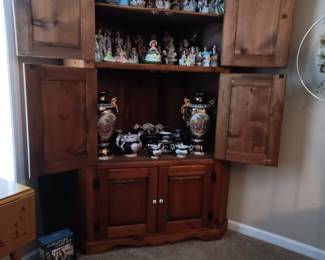 Corner cabinet full of figures 