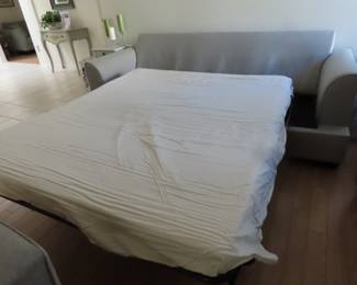 Lovely like new grey fabric queen size sleeper sofa with throw pillows.