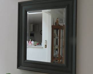 Framed mirror.