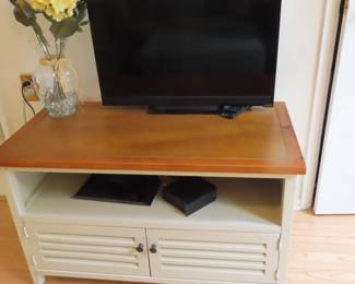 Vizio TV and TV stand.