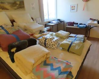 Bed linens, blankets and pillows.