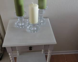 White end tabe and candle sticks.