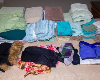 Assortment linens and women's clothing