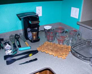 Assortment baking utensils and measuring cups
