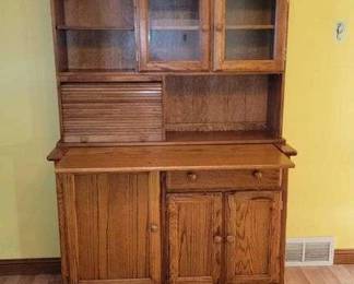 8 The Ashley Company Hoosier Cabinet. Has roll out conter top