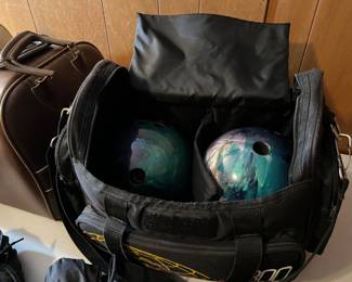 Bowling balls, rack, shoes, bowling bags