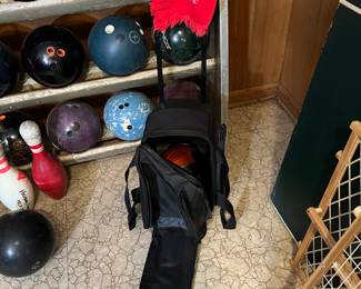 Bowling balls, rack, shoes, bowling bags