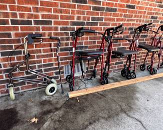 Rollator walkers with seats