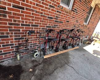 Rollator walkers with seats