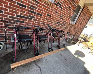 Rollator walkers with seats