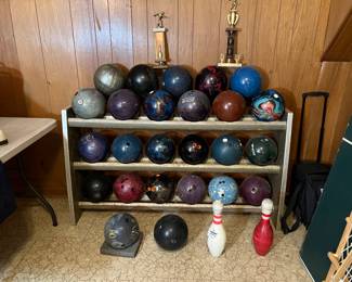 Bowling balls, rack, shoes, bowling bags
