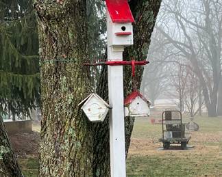 Two outdoor Birdhouses mounted in a old Milk Can - approximately 10-12' tall